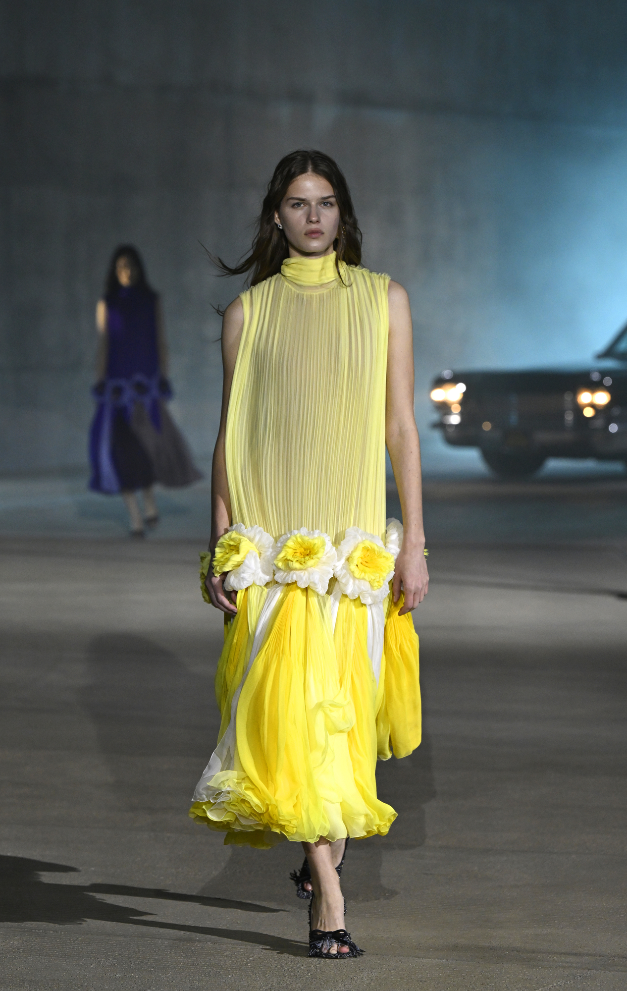 Dior Cruise 2027 — pale primrose-yellow Californian-poppy opener, LACMA David Geffen Galleries.