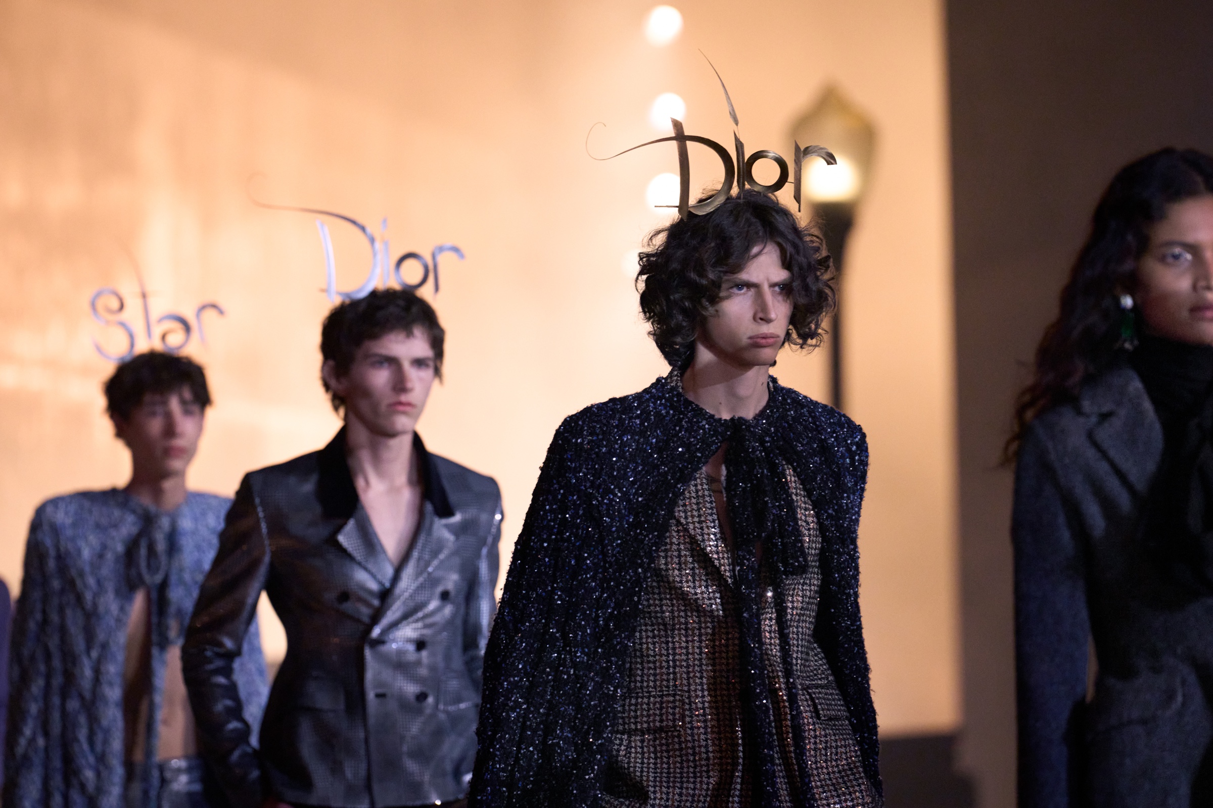 Dior Cruise 2027 — final closing sequence, male models in constructed looks scored to Air's Kelly Watch the Stars, LACMA David Geffen Galleries.